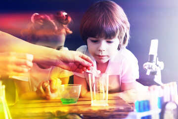 Background with highlights of children of scientists. A boy and a girl are experimenting in the laboratory.