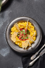Milanese-style risotto with beef tartare and Parmesan crisps, an upscale infusion of Italian flavors
