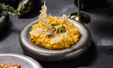 Milanese risotto with beef tartare and Parmesan crisps, aesthetically pleasing and elegant