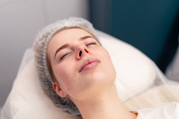 Fototapeta na wymiar close-up of a client's face during health rejuvenation beauty procedure in a beauty salon skin care