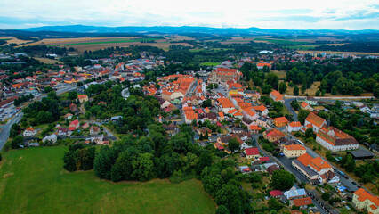 Aerial around the old town of Horsovsky Tyn in the Czechia on a cloudy day in summer