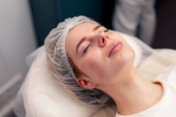 Obraz na płótnie Canvas close-up of a client's face during health rejuvenation beauty procedure in a beauty salon skin care