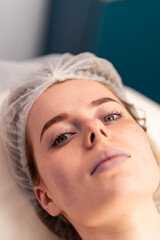 close-up of a client's face during health rejuvenation beauty procedure in a beauty salon skin care
