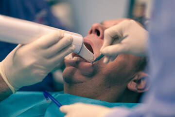 Close up on dentist tools, background is blurred and depth of field is shallow.