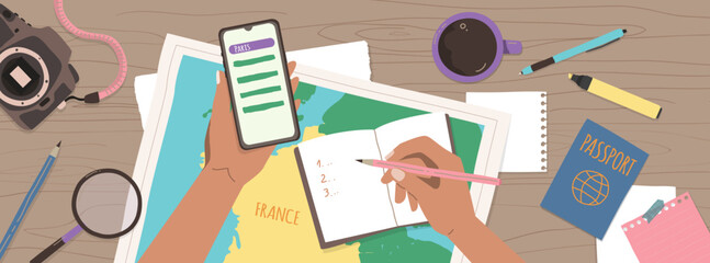 Woman planning her trip to France. Enroute France. Taking notes to notebook on map background. Finding a route on your smartphone. - obrazy, fototapety, plakaty