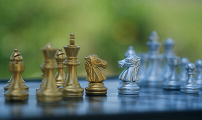 gold  knight Against whithe background, International chess, ideas and competition and strategy,...