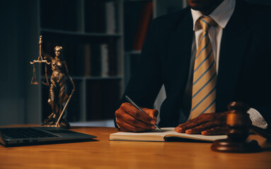 Judge gavel with Justice lawyers having team meeting at law firm background. Concepts of Law and Legal services.