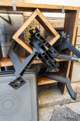Palermo, Sicily, Italy  A pile of old discarded restaurant furniture on a street corner.