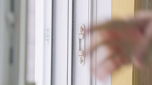 Men hand unlocked and opened a sliding patio door