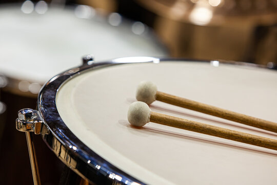  Drumsticks lie on timpani close-up