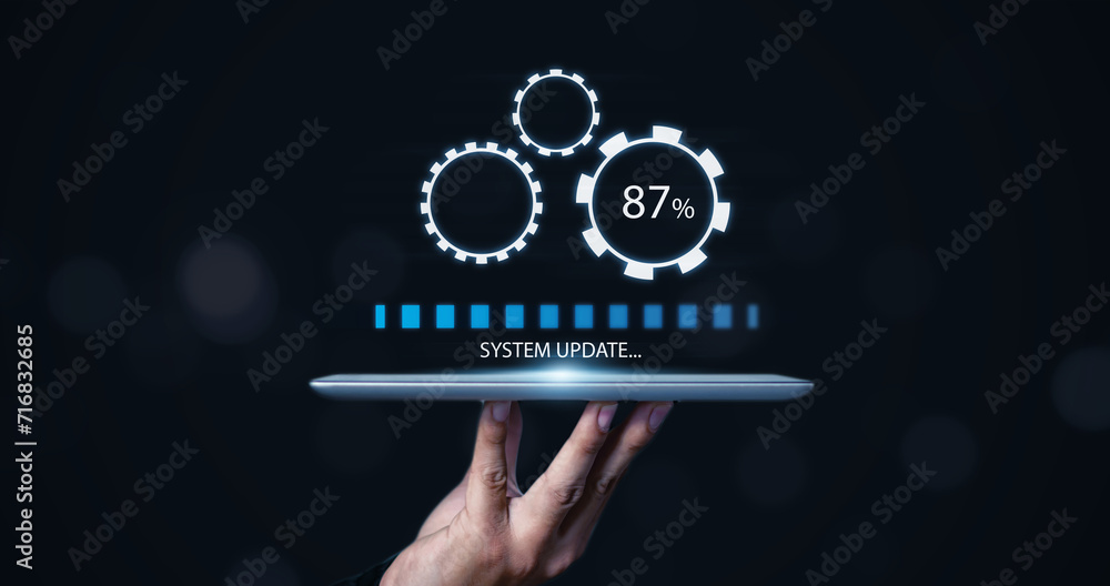 Fototapete Installing update system software for device operating systems to be up to date with the new version. Graphics icon showing updating function screen loading on computer tablet.