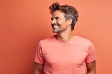 Portrait of a blissful man in his 30s dressed in a casual t-shirt against a solid color backdrop. AI Generation