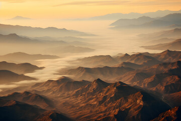 Naklejka premium Aerial view of bright foggy morning over dark hills with mountain forest trees. Beautiful scenery of wild woodland