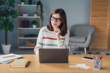 Portrait of clever minded person use laptop hand touch chin look window brainstorming contemplate...