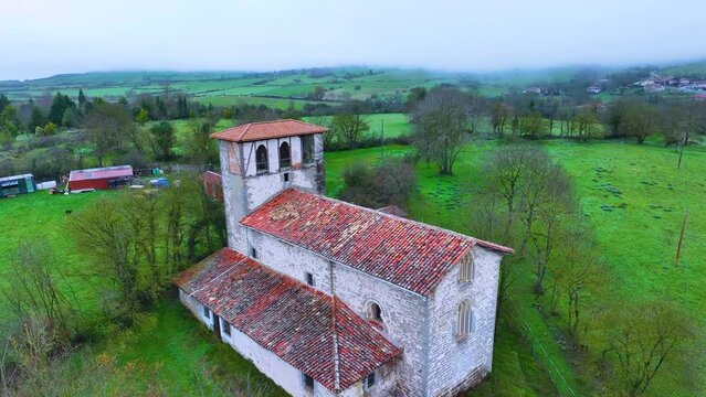 Landscape around the Church of San Juan Bautista in Oyardo in the municipality of Urcabustaiz. Aerial view from a drone. Oyardo. Alava. Basque Country. Spain. Europe