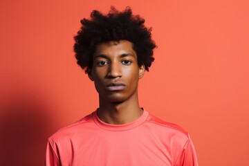 Obraz na płótnie Canvas Portrait of a tender afro-american man in his 20s sporting a breathable mesh jersey against a solid color backdrop. AI Generation