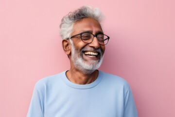 Portrait of a happy indian man in his 80s showing off a thermal merino wool top against a solid pastel color wall. AI Generation - obrazy, fototapety, plakaty