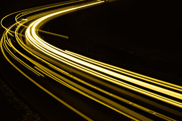 yellow car lights at night. long exposure