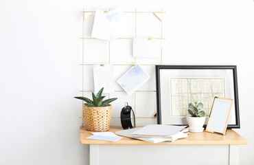 Fototapeta premium Working place at home with plants and moodboard