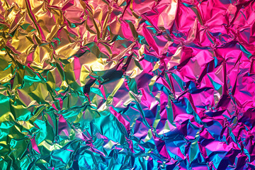 Rainbow-colored aluminum foil surface texture background 