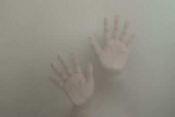 Silhouette hands behind the mirror Abstract style, One hand on a glass partition with blurry. Illustration of designer