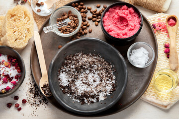 A woman's hand applies a natural coffee scrub. Skin care cosmetics. Beauty concept