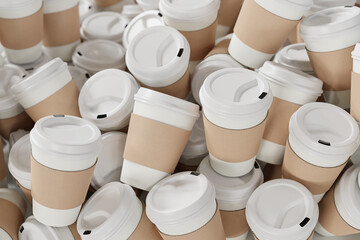 A heap of disposable white paper coffee cups with white lid and sleeves made from cardboard....