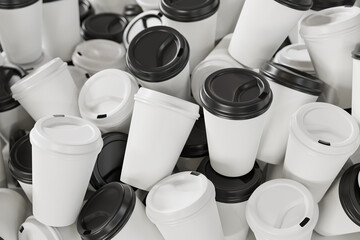 A heap of disposable white paper coffee cups with white and black  lids. Abundance of waste because of disposable containers.