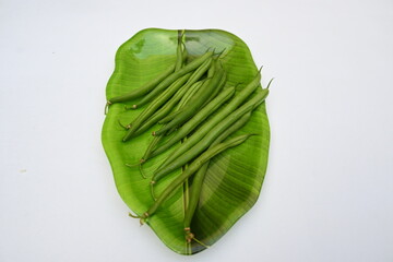 Naklejka premium Green beans. Many vitamins are found in it. Its other names names&nbsp;French beans,&nbsp;string beans,&nbsp;snap beans,&nbsp;snaps, and the French name&nbsp;haricot vert. Popular vegetable of all over world. 