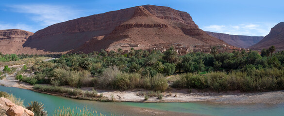 Panoramic view of a lush oasis in Morocco's desert landscape