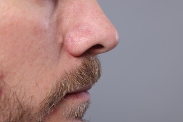 Closeup view of man with normal skin on grey background, space for text