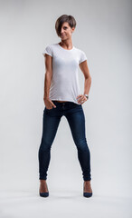 Assertive stance in jeans, radiating casual confidence