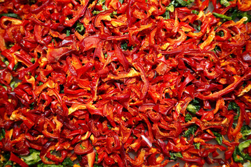 Fototapeta premium a lot of dried and sliced ​​red sweet bell peppers and a little green. view from above. food