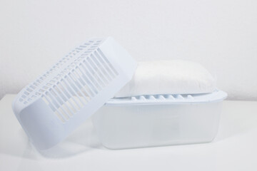 plastic dehumidifier with granules at home. combating moisture and mold in the home