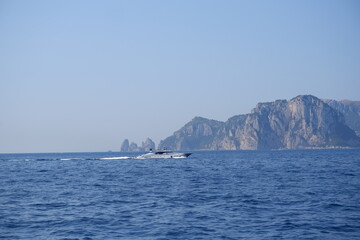 Fototapeta na wymiar Yacht floating in the Tyrrhenian Sea, Amalfi Coast, Italy 