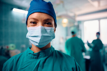 Fototapeta na wymiar Happy female surgeon in operating room looking at camera.