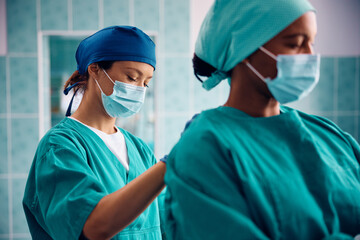 Female surgeons greeting ready for operating room.