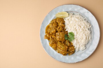 Delicious chicken curry with rice on beige background, top view. Space for text