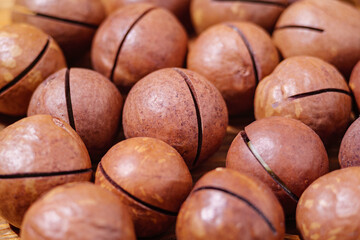 Pile Roasted Macadamia Nuts Pattern Texture Background, Side View. Natural Shelled Raw Macadamia Nuts in a Full Frame