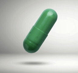 Green vitamin capsule in air on light grey background