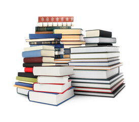 Stacks of different books isolated on white