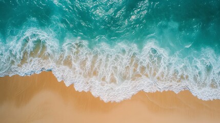 Top aerial view of a sandy beach with gentle waves background
