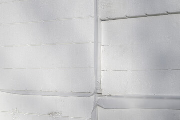 Stack of styrofoam insulation boards on construction site