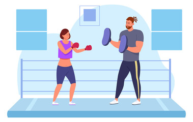 Martial arts training. Man couching woman to fight