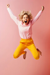 Exuberant jump of joy, woman in pink and yellow captures the essence of happiness and freedom