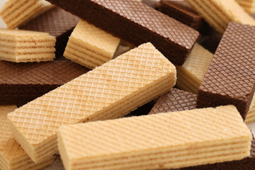 Stacked delicious chocolate wafers in large amount. Two different flavours of classic small waffles