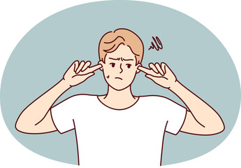 Offended guy closes ears does not want to hear toxic words or insults from peers or girlfriend. Embarrassed man trying to get rid of noise or loud music played by rude neighbors.