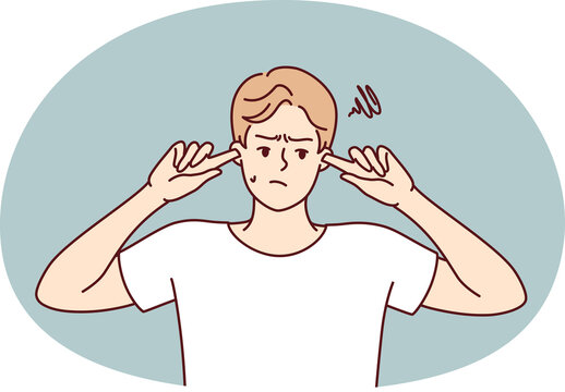 Offended guy closes ears does not want to hear toxic words or insults from peers or girlfriend. Embarrassed man trying to get rid of noise or loud music played by rude neighbors.