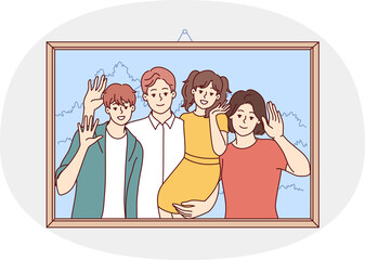 Happy family of man and woman with children are depicted in portrait in wooden frame hanging on wall. Cheerful boy and girl together with parents pose for family photo.