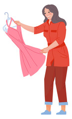 Woman looking on pink dress. Clothes shopping person